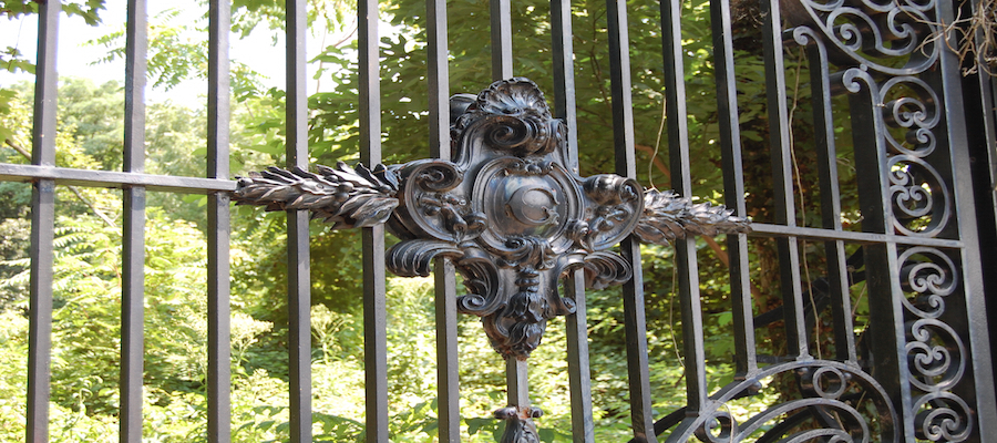 Decorative Guggenheim estate emblem on a gate